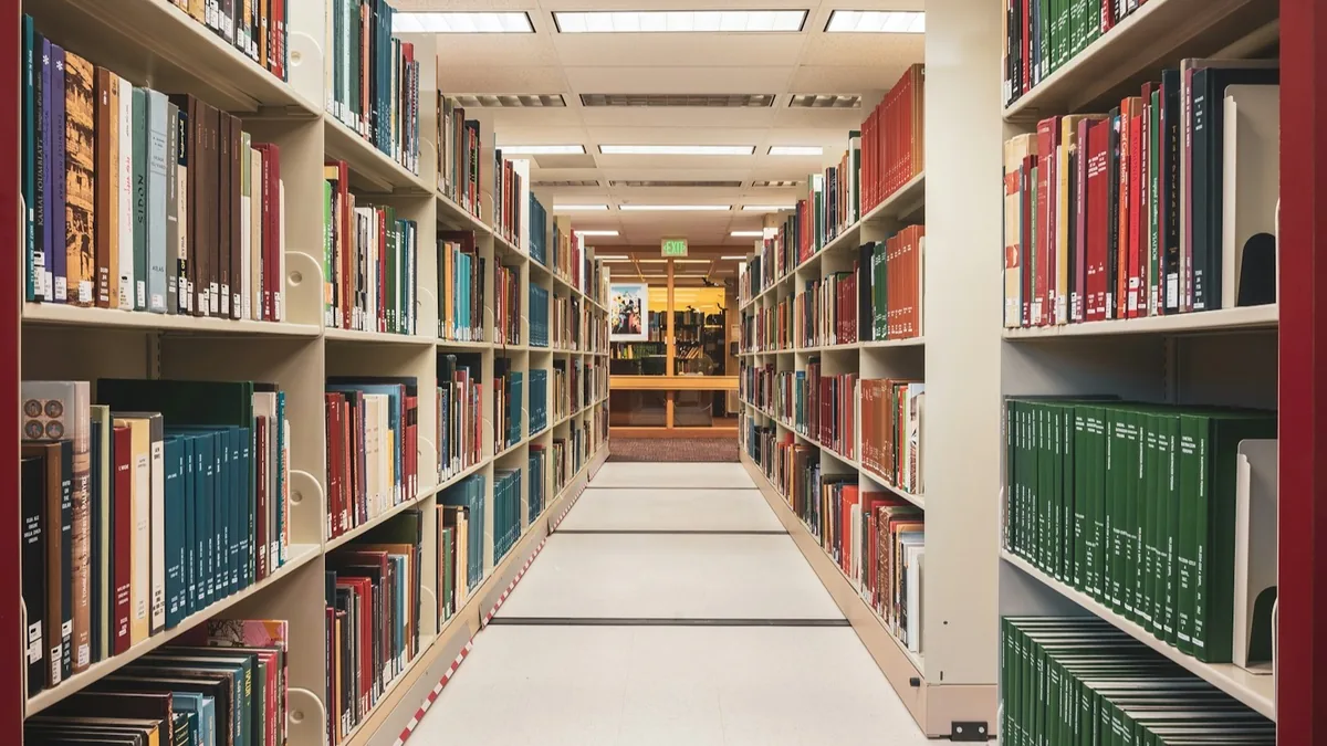 Journal volumes on a library shelf
